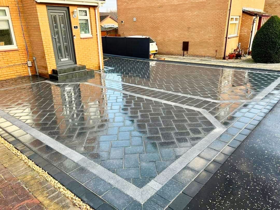Grey paved driveway with contrasting border